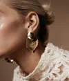 Shashi Twisted Statement Earrings In Gold In Gold