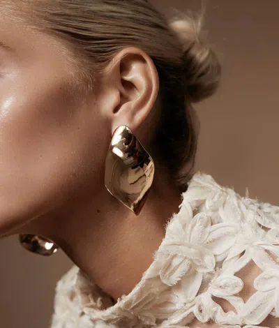 Shashi Twisted Statement Earrings In Gold