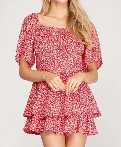 SHE + SKY FLUTTER HALF SLEEVE LAYERED ROMPER IN RED FLORAL PRINT