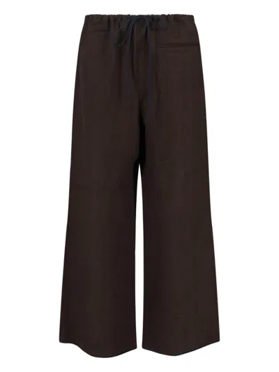 SIBEL SARAL WIDE-LEG TROUSERS WITH ELASTIC WAISTBAND AND MINIMALIST DESIGN