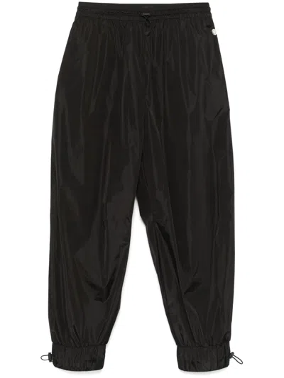 SIMONE ROCHA DAISY-EMBELLISHED TAPERED TROUSERS