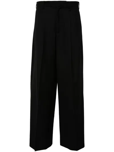SIMONE ROCHA PLEATED WIDE-LEG TROUSERS