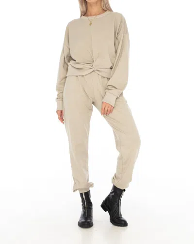 SKEMO LOUNGEWEAR TWISTED SWEATER IN CAMEL