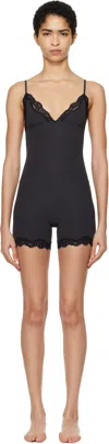 Skims Black Fits Everybody Lace Triangle Onesie Jumpsuit In Onyx