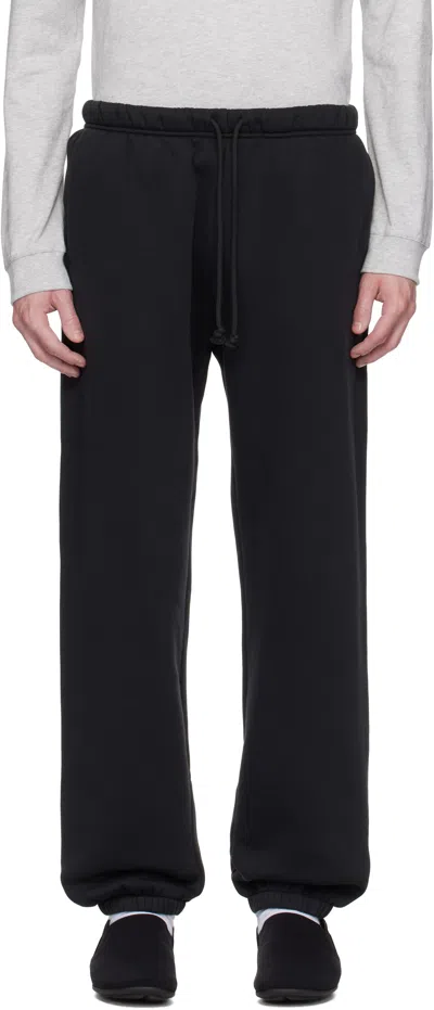 Skims Black Fleece Lounge Relaxed Sweatpants In Washed Onyx