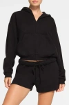 Skims Cotton Blend Fleece Zip-up Hoodie In Onyx