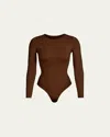 Skims Essential Smoothing Long-sleeve Thong Bodysuit In Cocoa