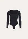Skims Essential Smoothing Scoop-neck Thong Bodysuit In Onyx In Black