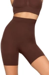 Skims Everyday Sculpt Mid Thigh Shorts In Brown
