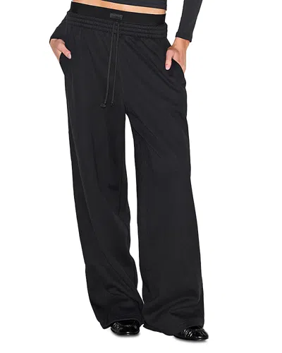 Skims Cotton Blend Fleece Exposed Boxer Pants In Black