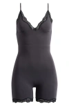 Skims Black Fits Everybody Lace Triangle Onesie Jumpsuit In Onyx