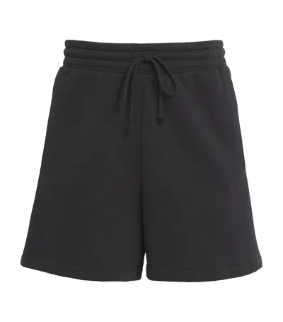 Skims Fleece Relaxed Lounge Shorts In Black