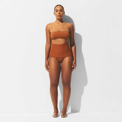 Skims Iconic Swim In Brown
