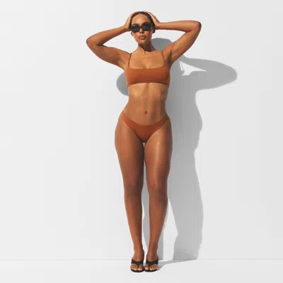 Skims Iconic Swim In Brown