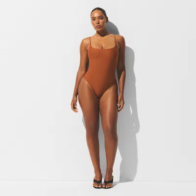 Skims Iconic Swim In Brown