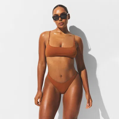 Skims Iconic Swim In Brown