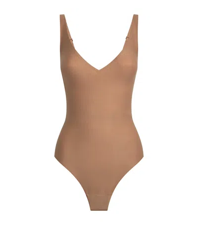 Skims Plunge Bodysuit In Sand