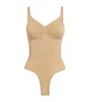 Skims Beige Seamless Sculpt Deep Plunge Thong Bodysuit In Nude