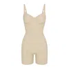 Skims Seamless Sculpt Mid Thigh Bodysuit In Sand