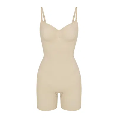 Skims Seamless Sculpt Mid Thigh Bodysuit In Sand