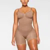 Skims Seamless Sculpt Strapless Mid Thigh Bodysuit In Sienna In Gold