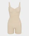 Skims Seamless Sculpt Strapless Shortie Bodysuit In Sand