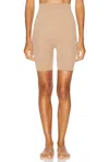 Skims Seamless Sculpt Mid Thigh Short In Brown