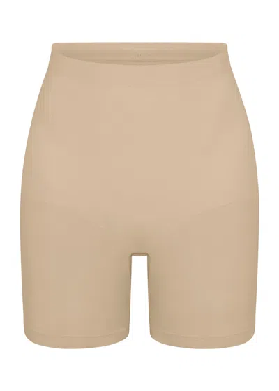 Skims Seamless Sculpt Mid-thigh Shorts In Sand