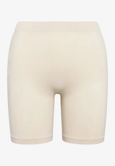 Skims Seamless Sculpt Mid-thigh Shaping Shorts In Sand