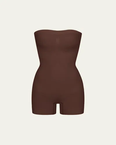 Skims Seamless Sculpt Strapless Shortie Bodysuit In Brown