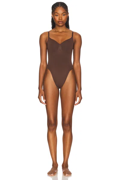 Skims Seamless Sculpt Thong Bodysuit In Brown