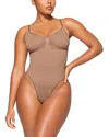 Skims Seamless Sculpted Brief Bodysuit In Brown