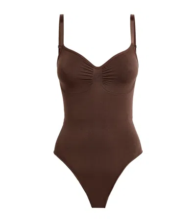 Skims Seamless Sculpt Thong Bodysuit In Brown