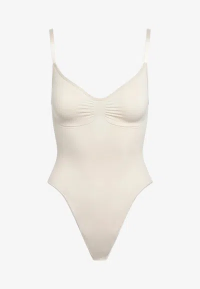 Skims Seamless Sculpt Thong Bodysuit In Sand