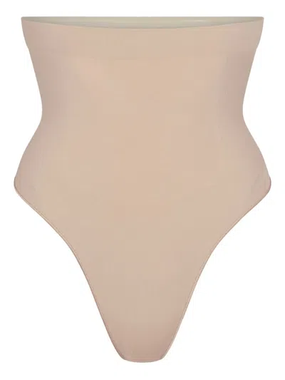 Skims Seamless Sculpt Thong In Gold
