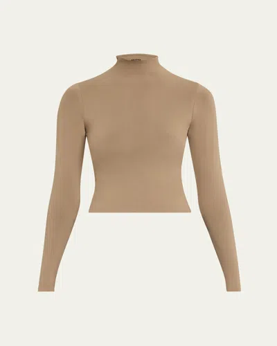 Skims Soft Smoothing Seamless Turtleneck In Truffle