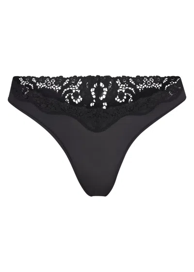 Skims Stretch-jersey Lace Trim Thong In Black