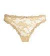 Skims Stretch-lace Dipped Thong In Nude