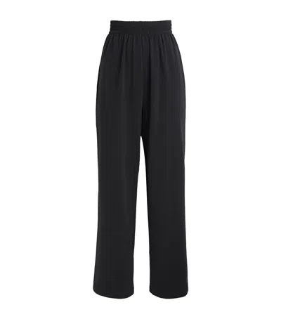 Skims Stretch-cotton Wide-leg Sweatpants In Black