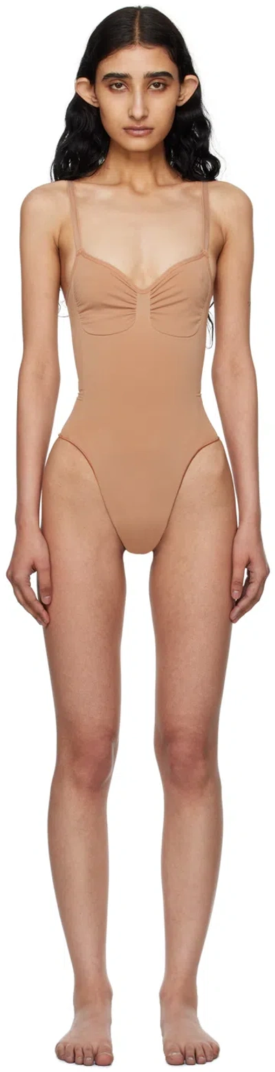 Skims Tan Seamless Sculpt Low Back Thong Bodysuit In Sienna