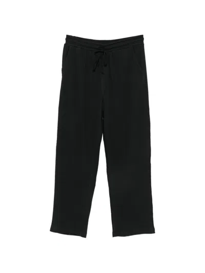 Skims Waffle-knit Drawstring-waist Trousers In Black