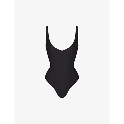 Skims Sleeveless Deep V-neck Thong Bodysuit In Onyx