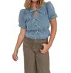 Sofie The Label Ashton Bow Peplum Blouse In Light Denim In Blue
