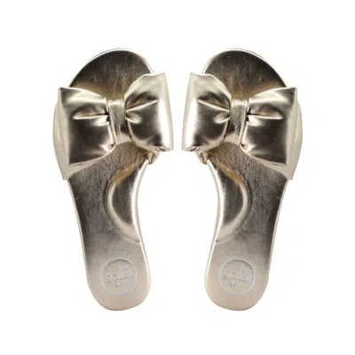 Solei Sea Rafie Bow Slide Sandals In Gold
