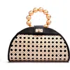 Soli & Sun The Isabella Tan Rattan Solihiya Weave And Gold Bead Top Handle Statement Bag In Black