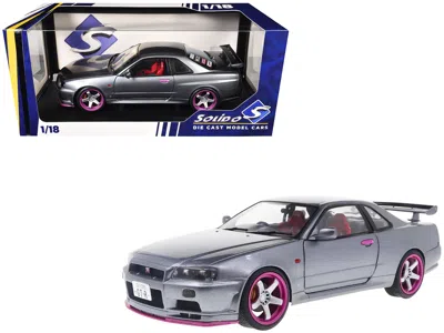 Solido 1999 Nissan Skyline Gt-r (r34) Rhd (right Hand Drive) Silver Metallic With Purple Wheels 1/18 In Gray