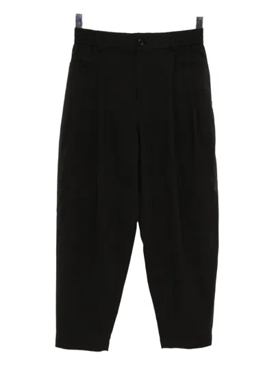 Songzio Homme Trousers In Black