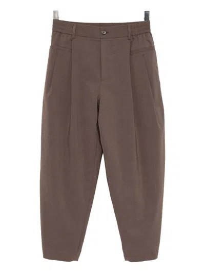 Songzio Homme Trousers In Brown
