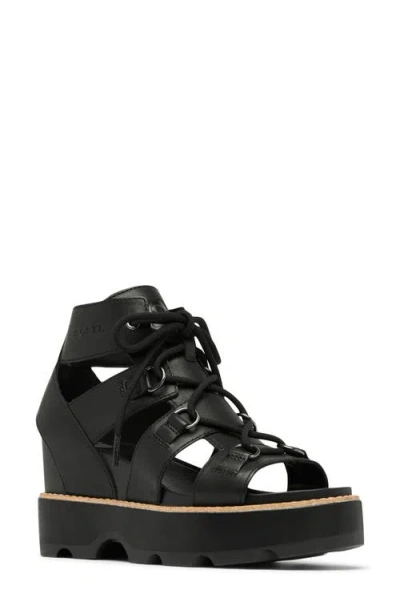Sorel Joanie Iv Lace Wedge Sandal In Black/black