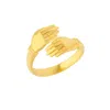 Spero London New Hug Ring With Hands Sterling Silver And Gold Plated In Gold